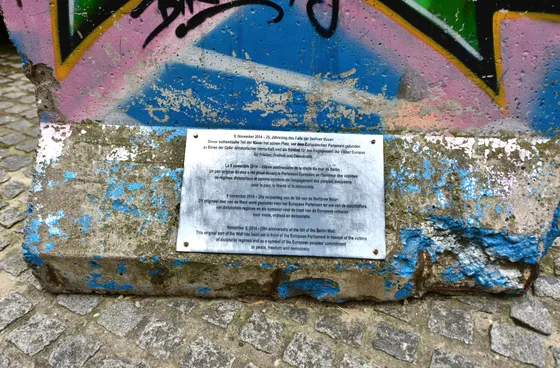 A graffitied Berlin Wall segment standing outside the European Parliament in Brussels.